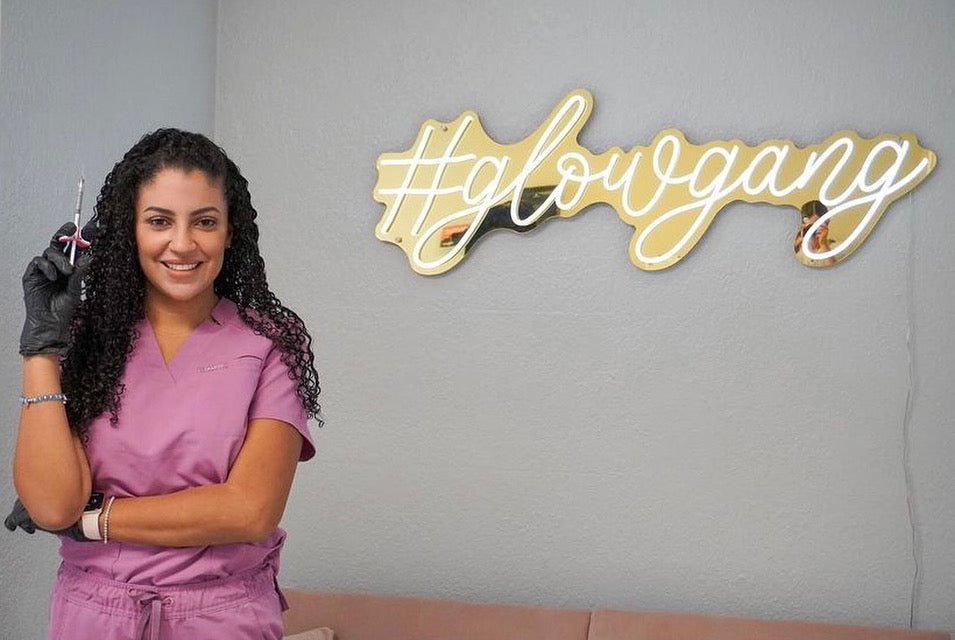 Gold hashtag glowgang sign in a beauty studio