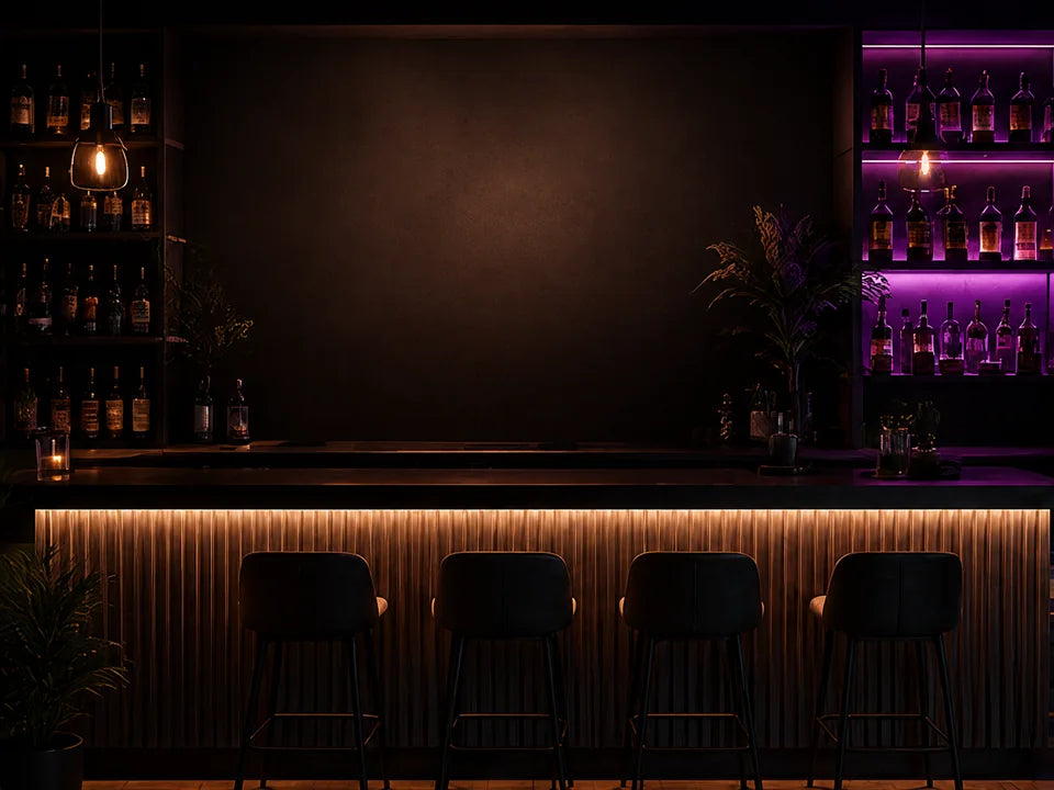 Warmly lit bar with a neon lettering concept