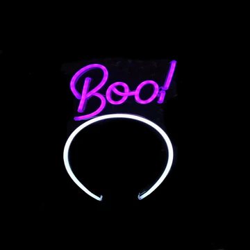 Boo! Glow neon headband glowing against a dark background