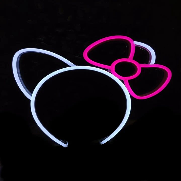 Kitty Bow neon headband glowing against a dark background
