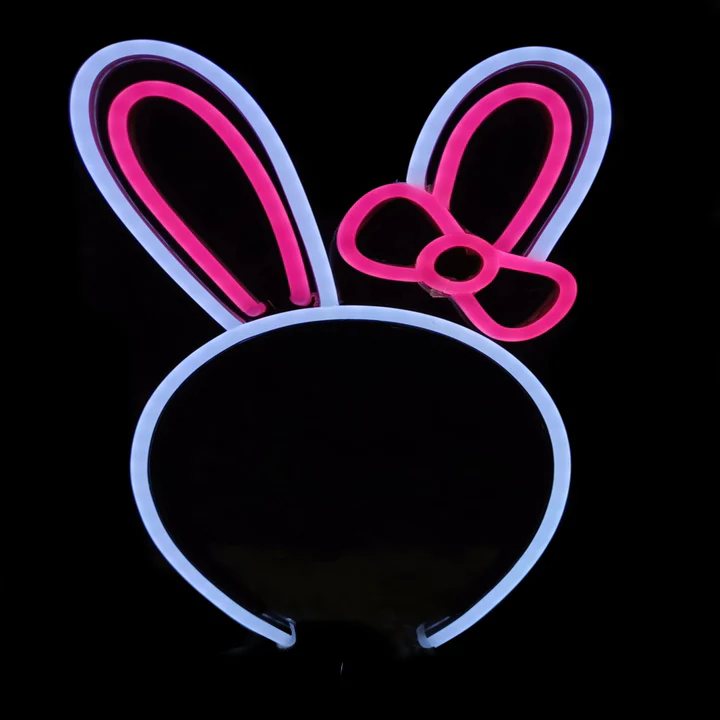 Bunny Bow neon headband glowing against a dark background