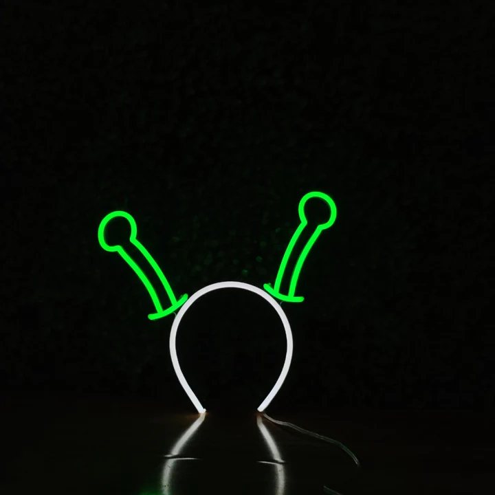 Alien Antennae neon headband glowing against a dark background