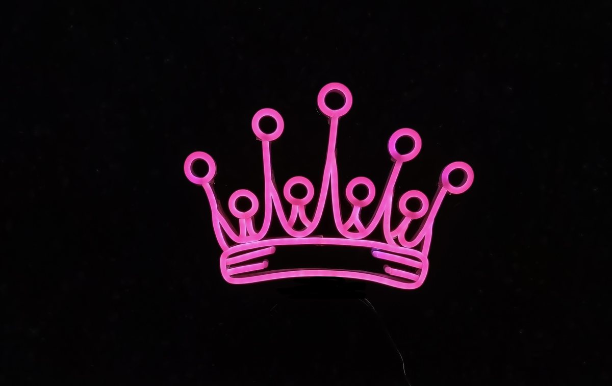 Princess Crown neon headband glowing against a dark background