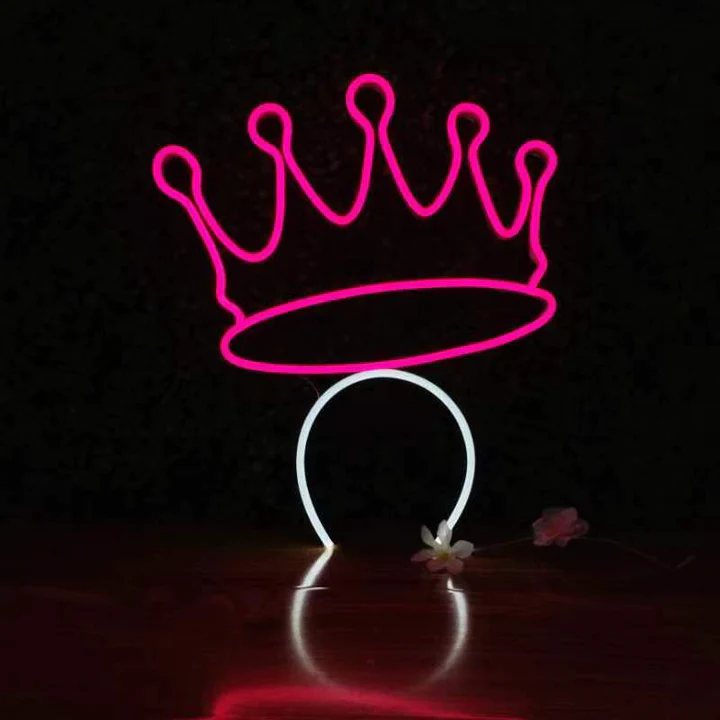 Royal Crown Halo neon headband glowing against a dark background