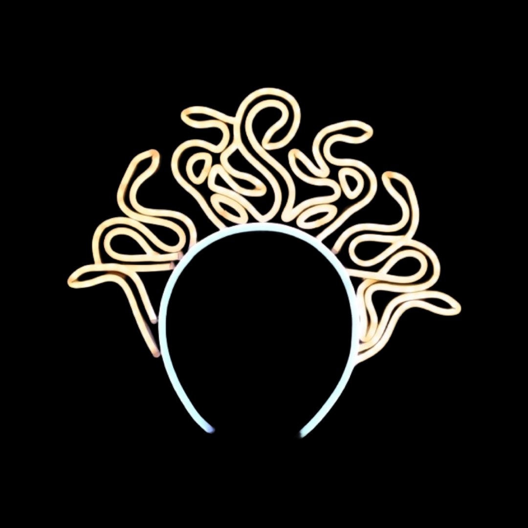 Medusa Serpent Crown neon headband glowing against a dark background