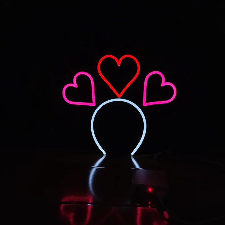 Sweetheart Halo neon headband glowing against a dark background