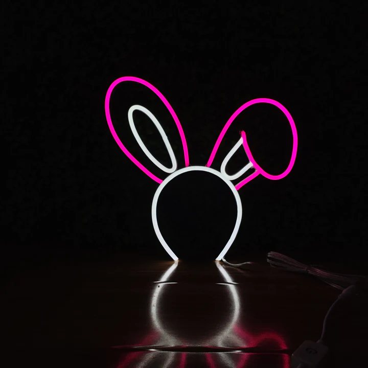 Bunny Ears neon headband glowing against a dark background