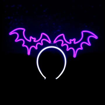 Bat Wing Halo neon headband glowing against a dark background